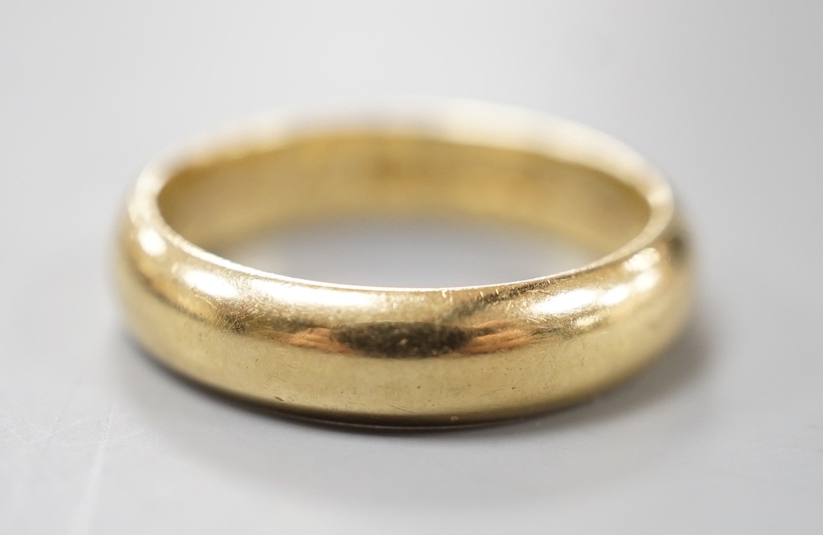 A 1970's 18ct gold wedding band, with engraved inscription, size O/P, 6.7 grams.